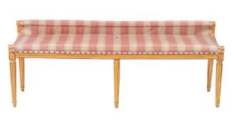 A carved giltwood banquette in the Louis XVI taste:,