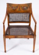 An early 19th Century satinwood and decorated elbow chair:,