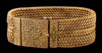 A plaited hair bracelet with foliate gold clasp: approximately 25mm wide, 22.5gms gross weight.