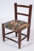 A child's early 19th Century beechwood chair:,