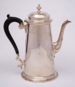 A silver coffee pot, all marks worn, Sheffield: of cylindrical tapering outline,