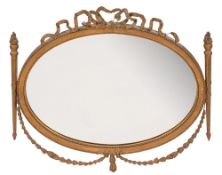 An Edwardian carved giltwood and gesso oval mirror:,