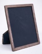 An Elizabeth II silver easel photograph frame, maker P H Vogel & Co, Sheffield,