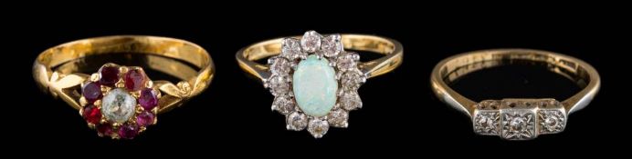 A smokey quartz single-stone dress ring, a 9ct gold wedding band, a 9ct gold two-colour band,