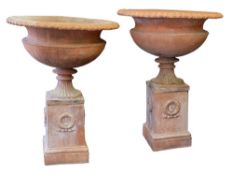 A pair of large Italian terracotta gardens urns: in the neo classical taste with egg and tongue