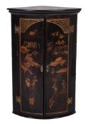 An 18th Century black lacquer and chinoiserie bow-fronted hanging corner cupboard:,