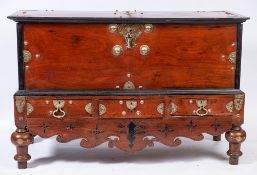 An early 19th Century Dutch East Indies mahogany, ebony and brass mounted coffer on a stand:,