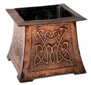 An Art Nouveau period copper planter: of square tapering form, with embossed panels to the sides,