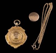 A 9ct gold 'Victoria College of Music London' pendant,