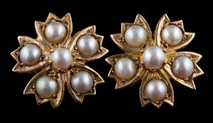 A pair of Victorian seed pearl-set floral cluster screw-back earrings: approximately 15mm diameter,