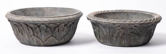 A matched pair of Indian carved stone bowls: with flared rims, each carved with foliage,