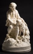 A pair of 19th century parian figures of a seated boy and girl with pet dogs: the girl handing a