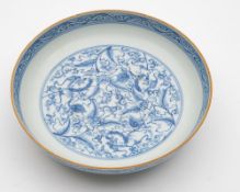 A Chinese blue and white dish: the interior painted with a medallion of Buddhist lions amongst