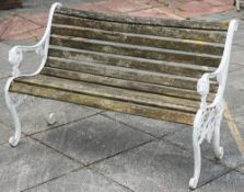 A pair of Victorian matched cast iron garden seats: with slatted wood rails,