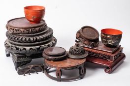A group of Chinese carved hardwood and other stands together with one cover: 12-28cm [10].