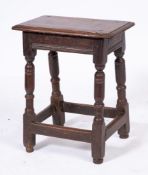 A 17th Century oak joynt stool:, with a rectangular moulded top and channel moulded frieze,