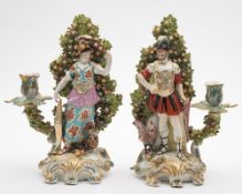 A pair of large Continental candlestick figures of Mars and Minerva: after Chelsea originals,