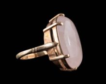 A 9ct gold and rose quartz single-stone ring: the oval rose quartz approximately 24mm long,