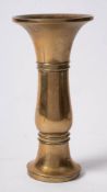 A Chinese bronze vase, Gu: of slender form with flared neck, the body cast with two double rings,