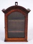 An 18th Century oak wall mounted domed display cabinet:, of small size,