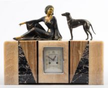 An Art Deco marble clock with lady and greyhound: the eight-day duration movement striking the