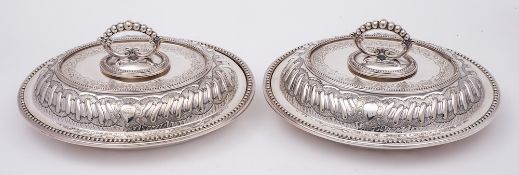 A pair of electro-plated oval entree dishes and covers, by Mappin Brothers: crested,