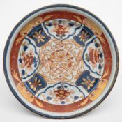 A Chinese Imari armorial serving dish for the Dutch market: with ogee moulded rim,
