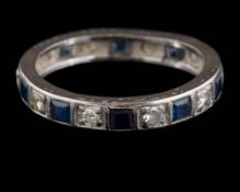A sapphire and diamond eternity ring: set with round,