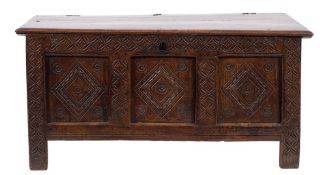 An 18th Century oak coffer:, with a plain rectangular hinged top,