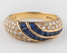 An 18ct gold, sapphire and diamond bombe ring: set with graduated,