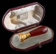 A 19th century cornelian-handled desk seal with chalcedony monogram intaglio: approximately 52mm