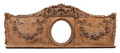 A carved limewood overmantel:, with pierced acanthus scroll and flowerhead cresting,