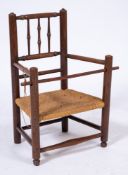 A child's early 19th Century beechwood elbow chair:,