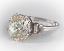 A diamond single-stone ring: with cushion-shaped modified old brilliant-cut diamond approximately