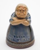 A Royal Doulton stoneware 'Votes For Women' Suffragette figural inkwell: the virago woman with arms