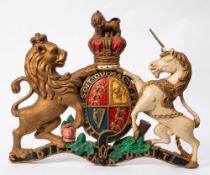 A cast metal and polychrome decorated Royal Coat of Arms:, 70cm wide.