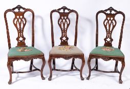 A set of six 18th Century Portuguese carved rosewood dining chairs:,