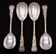 A set of four Victorian silver Bacchanalian pattern spoons, maker H J Lias & Son, London,