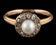 A pearl and diamond circular cluster ring: the central pearl (untested) approximately 5.