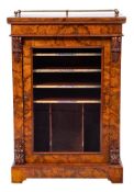 A Victorian figured walnut music cabinet:, with a brass three quarter gallery rail,