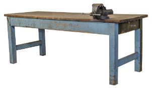 A pre World War II industrial mahogany rectangular work bench:, the plank top on square legs,