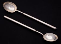 A pair of Elizabeth II silver cannon handled serving spoons, maker J W, Birmingham,