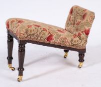 A 19th Century pine, oak and beechwood gout stool:, with needlework upholstery,