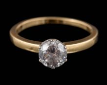 An 18ct gold and diamond solitaire ring: the round, brilliant-cut diamond approximately 6.