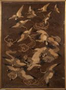 A Japanese silk embroidery: depicting a flock of cranes flying amongst clouds,