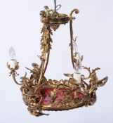 A brass and gilt metal four light chandelier:,