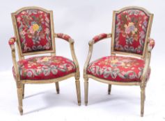 A pair of pale green and gilt decorated fauteuils in the Louis XVI taste:,