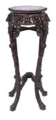 A Chinese carved hardwood octagonal jardiniere stand:,