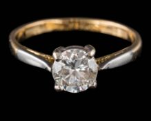 A diamond solitaire ring: the round brilliant-cut diamond approximately 6mm diameter x 3mm deep,
