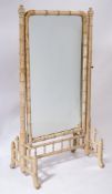 A decorated simulated bamboo swing frame cheval mirror:,